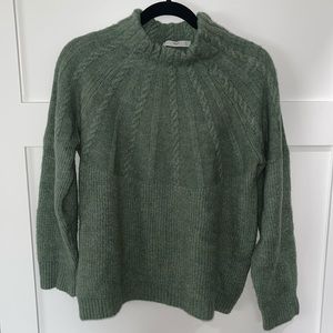Women’s sweater with cable knit detail